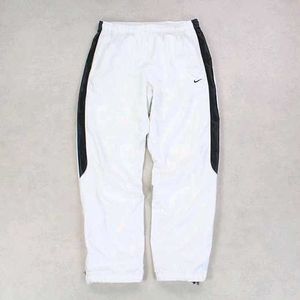 NIKE PARACHUTE BAGGY TRACKS.