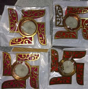set of four diyas with swastik