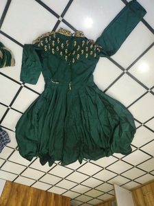 Luxurious Silk Dark Green Gown With Golden Stone