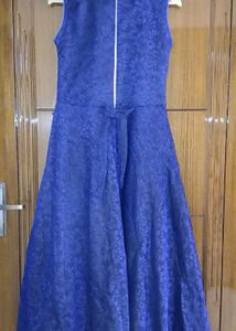 Navy Blue Gown With A Flower.