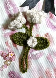 lily of the valley and tulip purse charm.