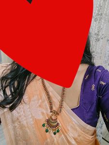 Crossandra saree with purple heavy blouse
