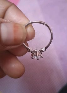beautifull silver color ring, adjustable with intact stone..