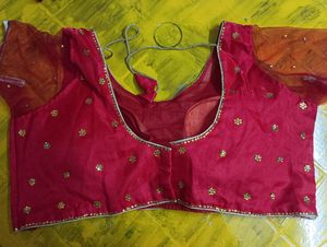 Readymade Saree Blouse In Tomato Red Color With Golden Work (Sequence Pasted) With Net sleeves ,good To Fit 40 To 42 Size Breast.