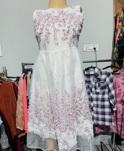 White dress with floral embroidery
