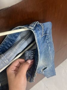 Ripped Knee Denim Jeans