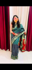 Dark green silk saree with stiched blouse