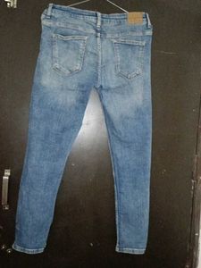 Ripped Knee Jeans