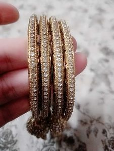 Golden Bangles with Dangling Charms