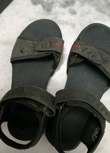 A Lightly Used Black Sandle