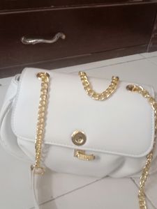Brand New small sling with gold slin