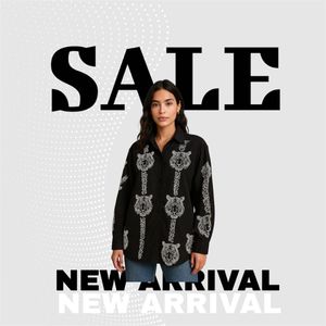 black oversized button-up shirt.