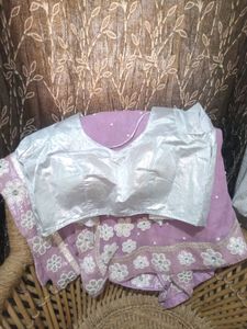 A very beautiful lavender colour saare with jdau work and shimmery padded blouse