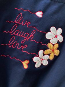 A Navy Blue Top With Flower Embroidery