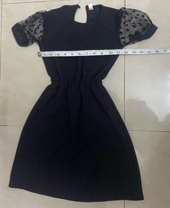 Chic Black Dress with Polka Dot Sleeves