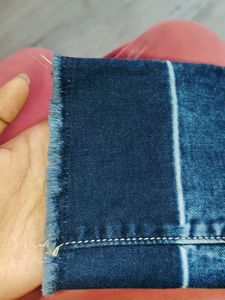 Navy Blue Ripped Jeans With A Design On Bottom