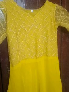 Beautiful Mustard Gown With Netted Layer