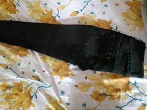 It Is Black Jeans With Tag And Solid  Colour