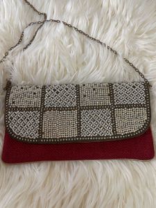 It’s a brown party wear clutch