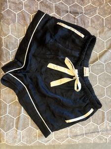 black satin shorts