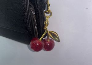 COACH DUPE RED CHERRY CHARM KEYCHAIN