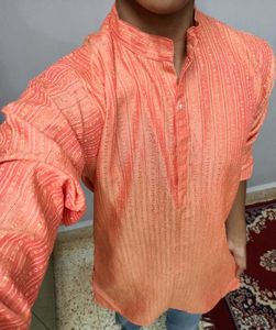 Orange Kurta With Silk Work On It.