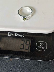 Pure silver ring with green zircon stone.