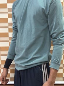 Green long-sleeved shirt