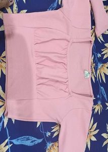 a pink top