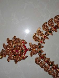 Elegant Gold-Toned Necklace with Red Stone Pendant
