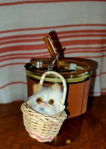 &#34;Fluffy Cat Keyring in Woven Basket&#34;