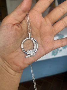 Elegant Silver Knot Pendant/new