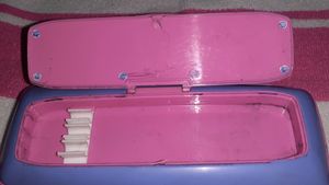 A pencil box with white board