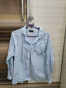 blue shirt with white stripes