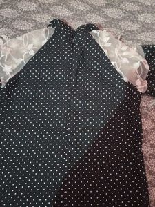 A Black Polyster Top With White Dots Nd Classic .