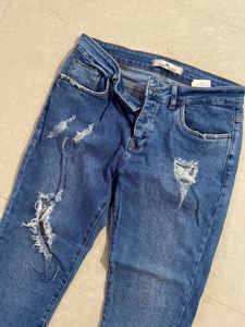 Ripped Blue Denim Jeans