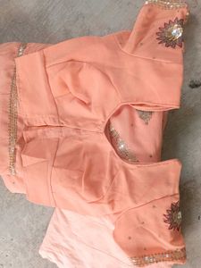 Peach colour saree with blouse and peticoat