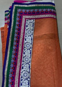 Orange Saree with Colorful Embellishments
