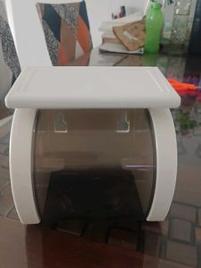 white tissue holder with flat storage on top