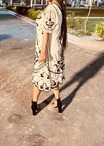 A Beautiful Dress With Black Embroidery...