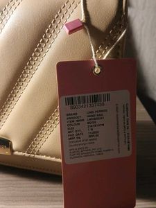 Lino Perros Quilted Sling Bag