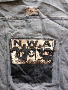 Distressed Blue Denim Jacket With A Touch Of 90s