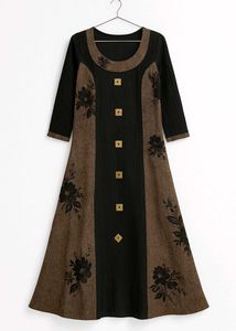 This elegant, long A-line ethnic dress features a