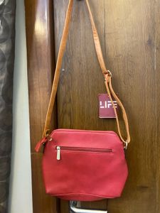 Woman’s Cherry Colored Bag