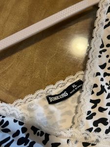 BONKERS corner white and black animal printed top