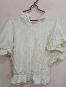 Ruffled Top with Neckline Embellishment