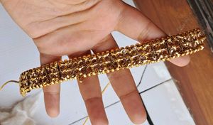 Gold-toned choker with earrings and headpiece