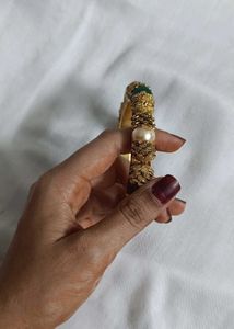 Gold-tone Bangle.