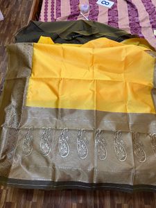 Elegant Yellow Art Silk Saree With A Classy Bangle