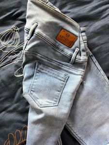 Ripped Light Wash Denim Jeans